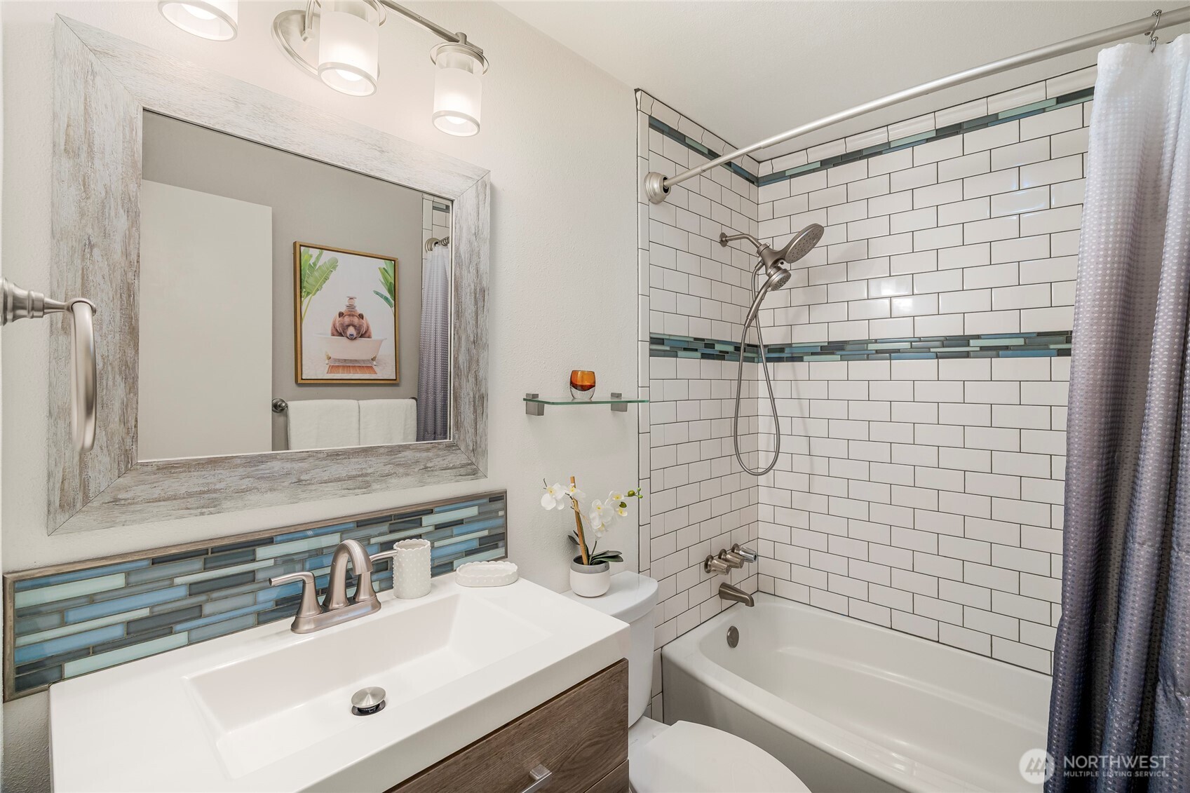 9537 South 213th Street Kent, WA 98031 - Photo 21 of 31 a bathroom with a sink mirror toilet and bathtub