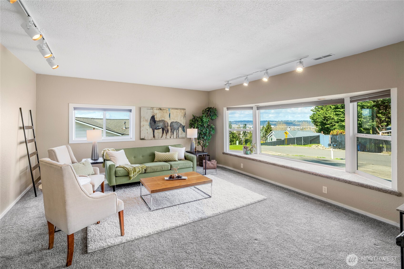 9537 South 213th Street Kent, WA 98031 - Photo 7 of 31 a living room with furniture and a large window