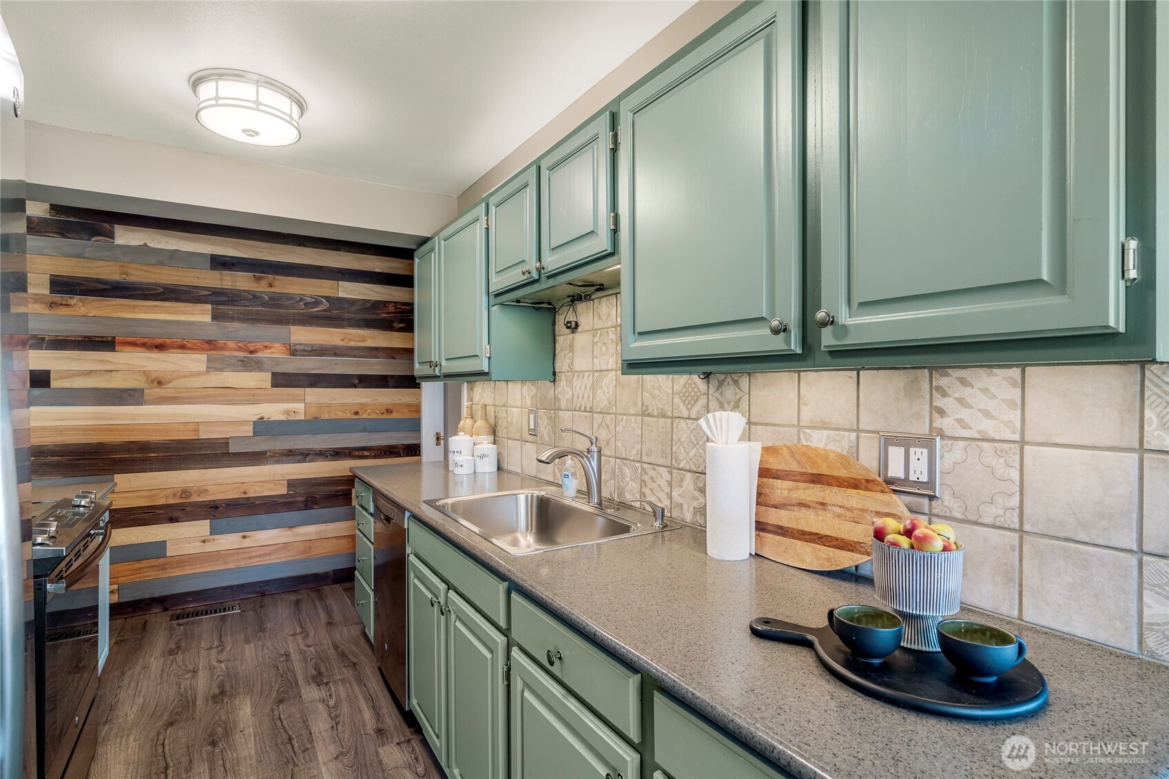 9537 South 213th Street Kent, WA 98031 - Photo 10 of 31 a kitchen with a sink and cabinets