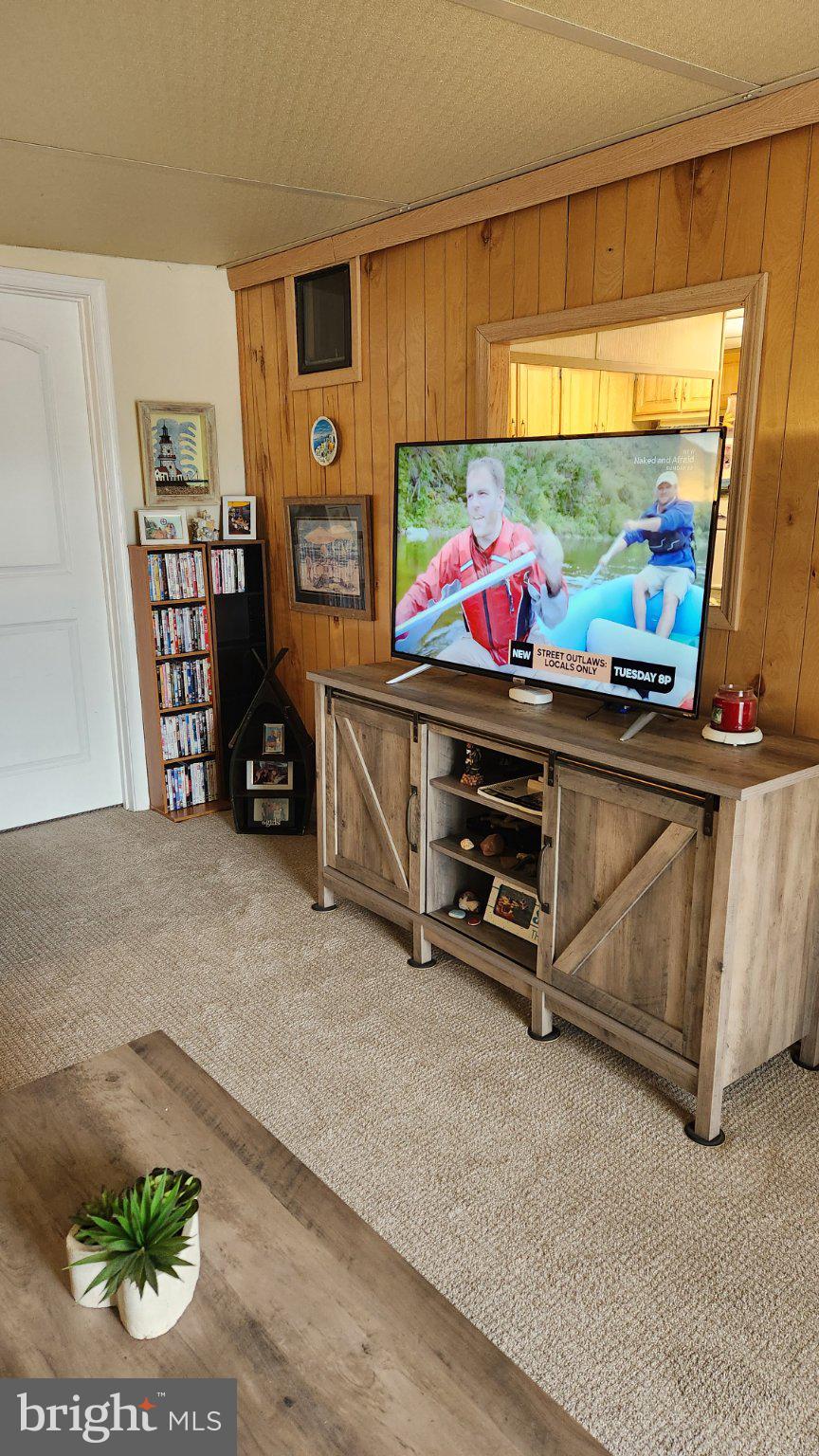 111 Beach Harbor Road, Unit 194C Grasonville, MD 21638 - Photo 22 of 24 Cozy living space with rustic charm.