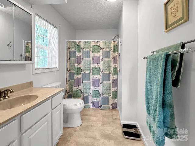 a bathroom with a sink a vanity and a bathtub
