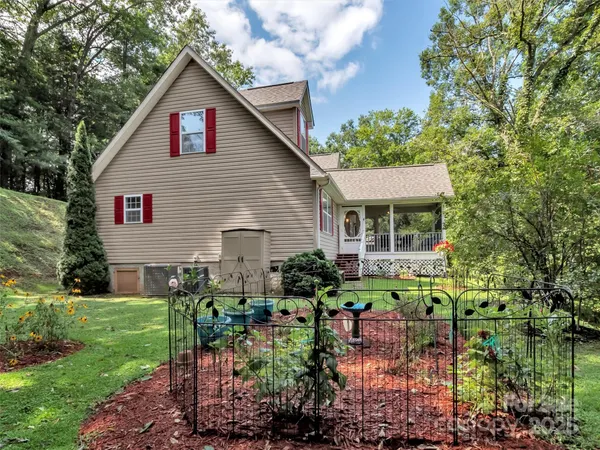 a view of backyard with garden and plants