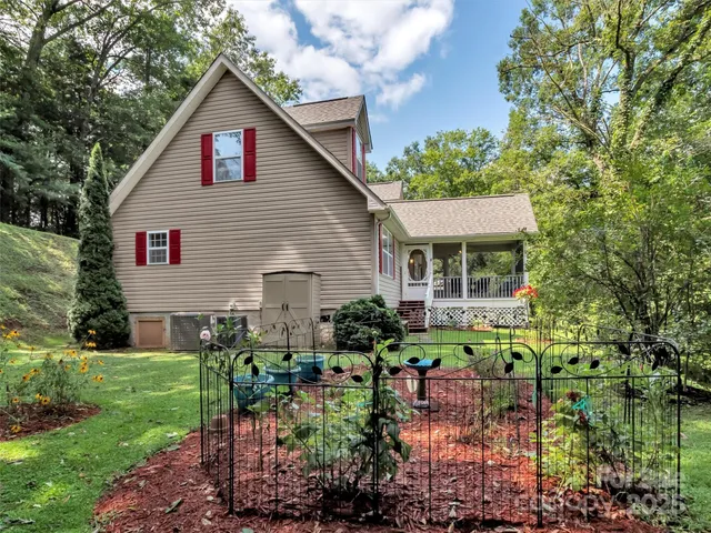 a view of backyard with garden and plants