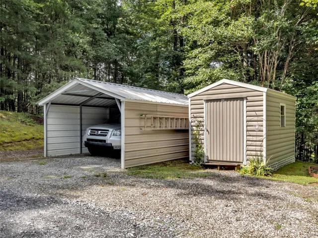 an aerial view of a house with yard and outdoor seating