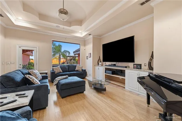 a living room with furniture and a flat screen tv