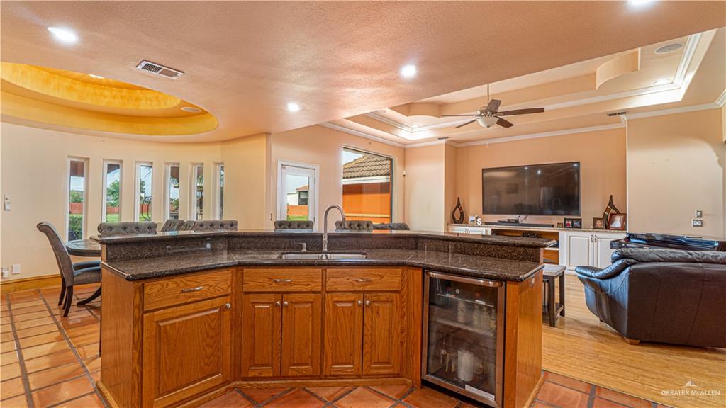 804 Inspiration Drive Pharr, TX 78577 - Photo 39 of 39 a view of a kitchen counter top space with stainless steel appliances wooden floor and a view of living room