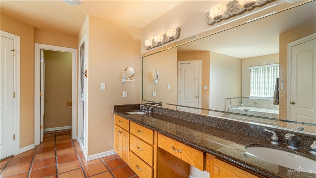 804 Inspiration Drive Pharr, TX 78577 - Photo 19 of 39 a bathroom with a sink and a mirror
