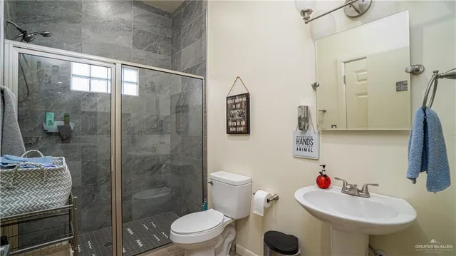 a view of gym equipment with wooden floor