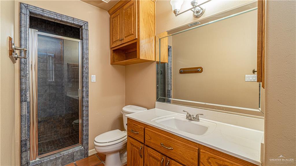 804 Inspiration Drive Pharr, TX 78577 - Photo 25 of 39 a bathroom with a sink and a toilet