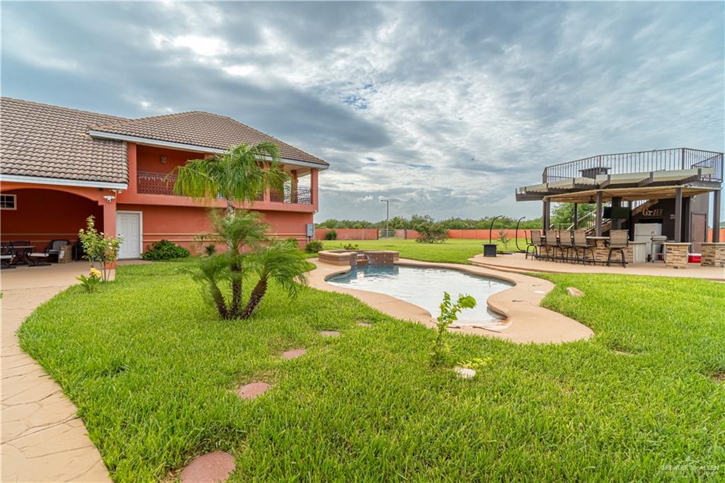 804 Inspiration Drive Pharr, TX 78577 - Photo 28 of 39 a view of a house with swimming pool and a yard