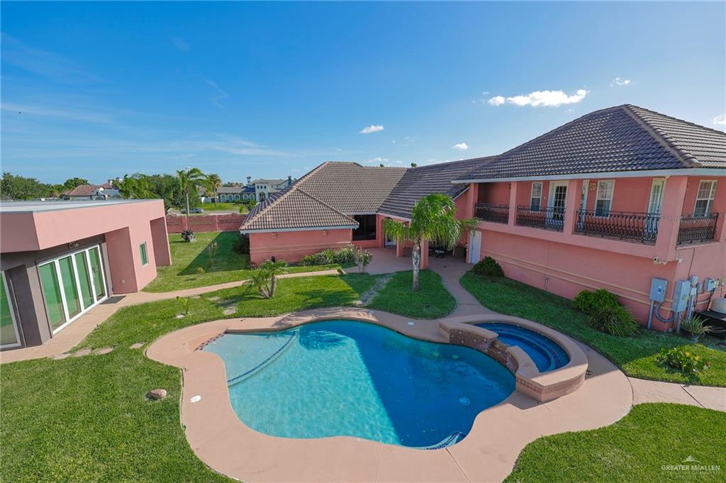 804 Inspiration Drive Pharr, TX 78577 - Photo 4 of 39 a view of a house with a big yard potted plants and large tree
