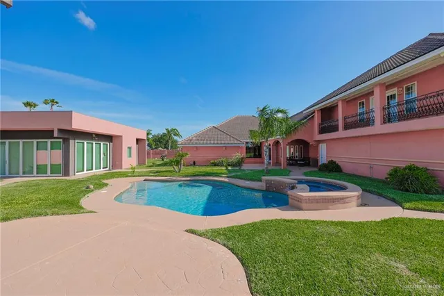 a front view of house with yard and outdoor seating