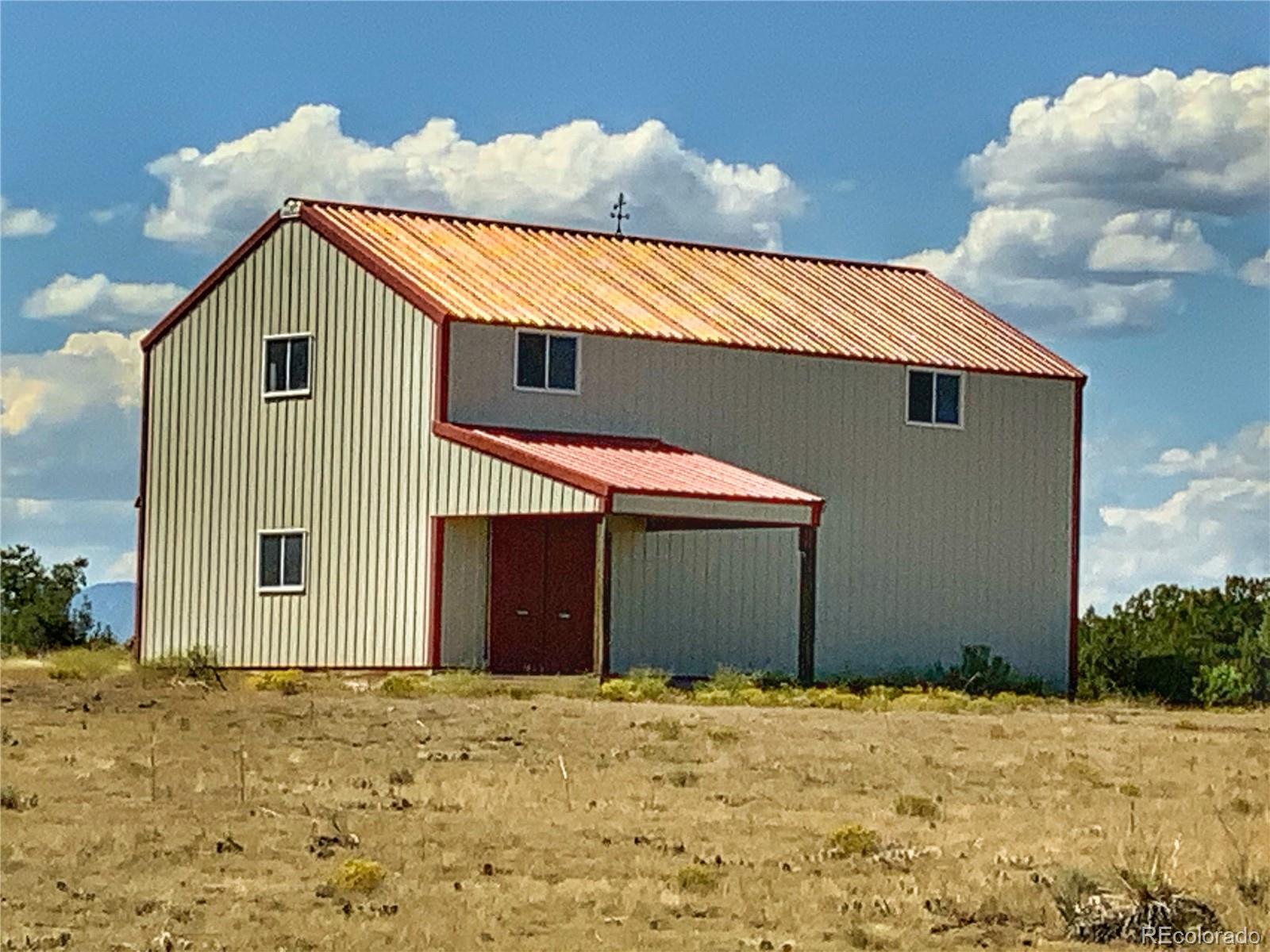 Turkey Ridge East, Unit 81 Walsenburg, CO 81089 - Photo 3 of 26 a view of garage and yard