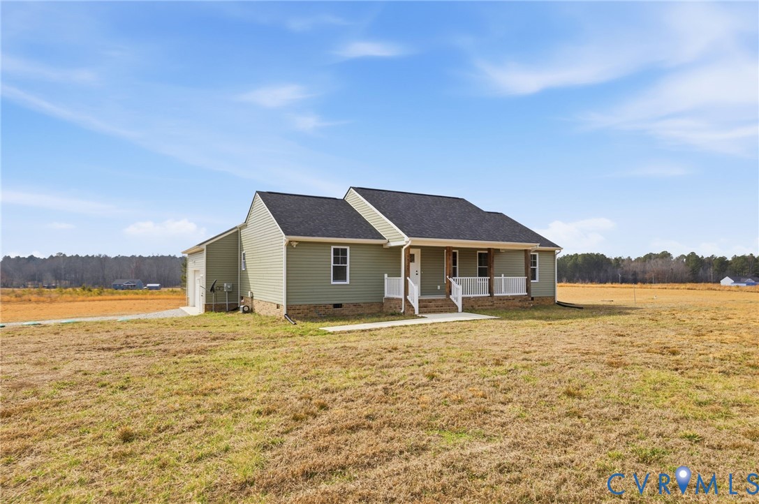 5245 Courtland Road Disputanta, VA 23842 - Photo 3 of 27 a front view of a house with a yard