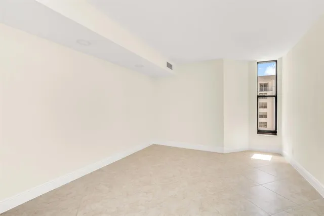 a view of empty room with closet