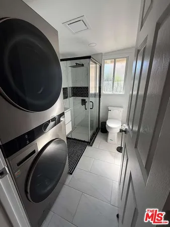 a bathroom with a toilet and a sink