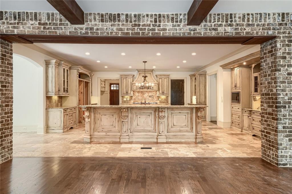 7965 Robin Road Cumming, GA 30041 - Photo 15 of 64 a view of a kitchen with dining table and chairs