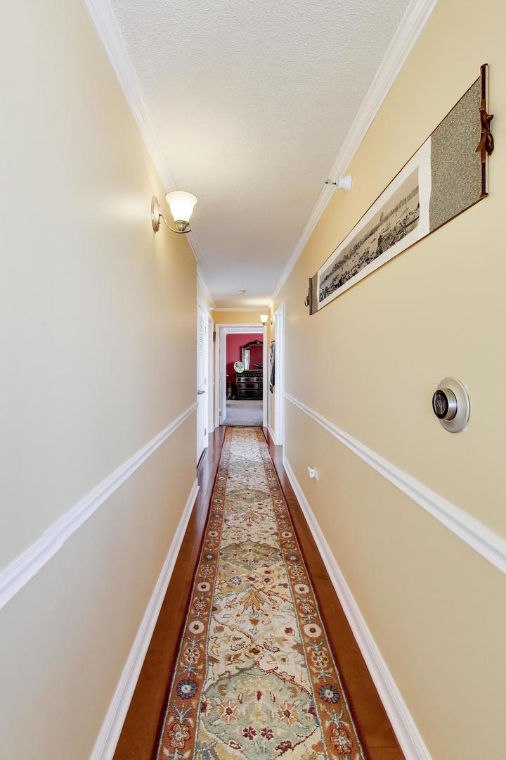 1720 Maple Avenue, Unit 2420 Evanston, IL 60201 - Photo 15 of 76 a view of a hallway with wooden floor