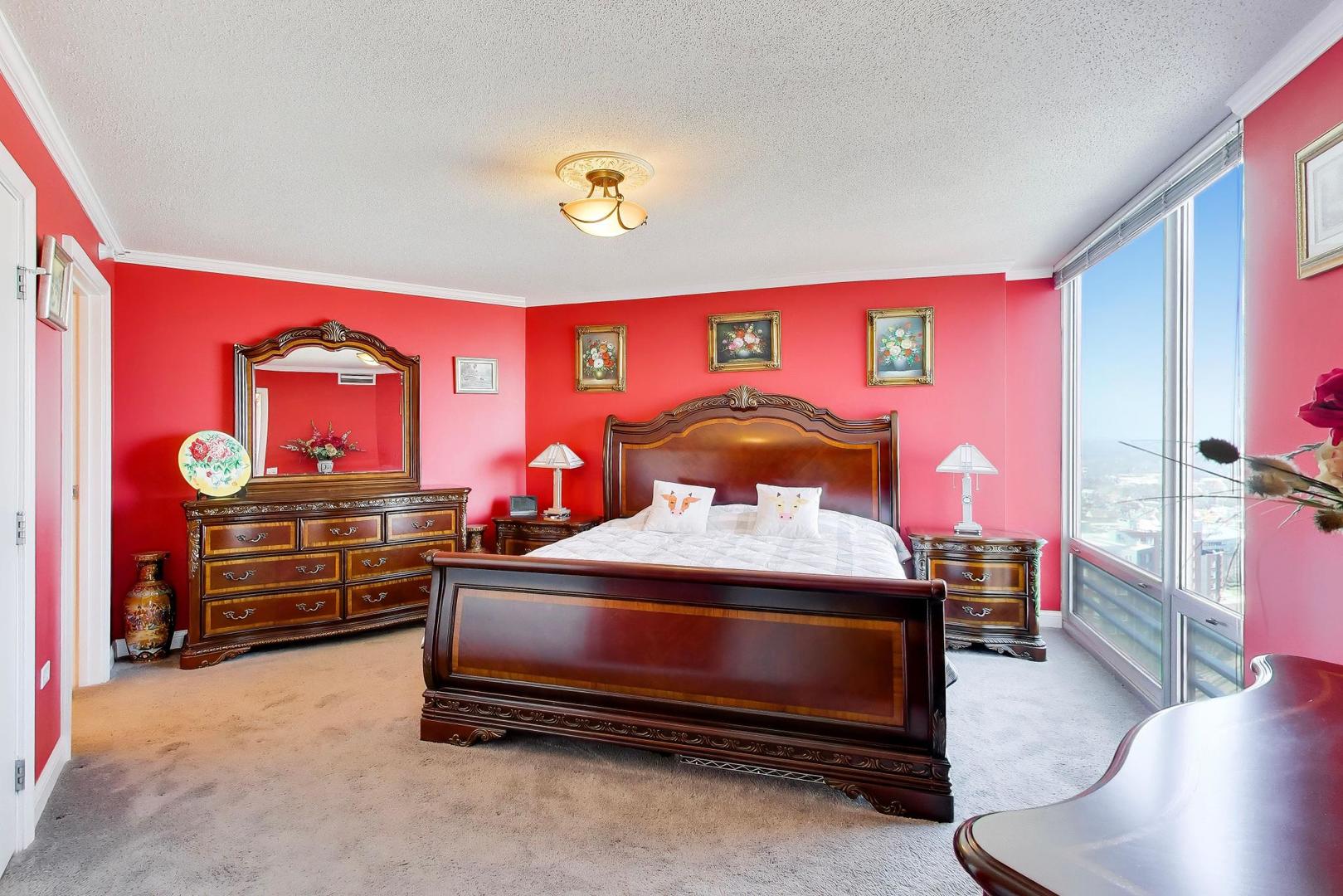 1720 Maple Avenue, Unit 2420 Evanston, IL 60201 - Photo 16 of 76 a bedroom with furniture and a flat screen tv
