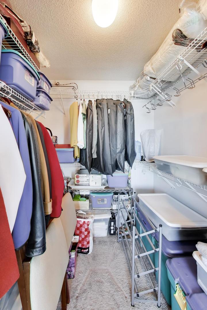1720 Maple Avenue, Unit 2420 Evanston, IL 60201 - Photo 22 of 76 a view of walk in closet with clothes and shoes