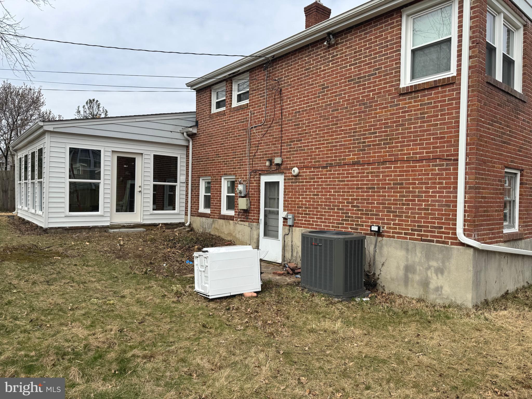 609 Wallerson Road Baltimore, MD 21228 - Photo 15 of 15 a brick house with a door and a chair