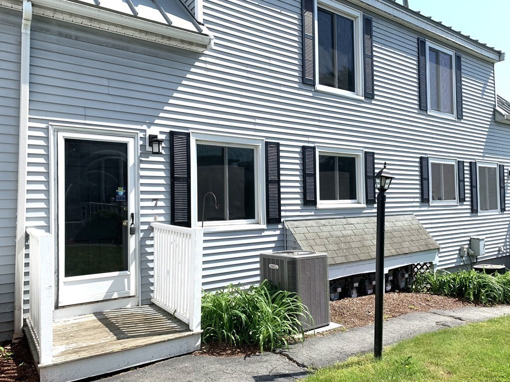 325 Mammoth Road, Unit 7 Lowell, MA 01854 - Photo 1 of 33 a view of a house with more windows and brick walls