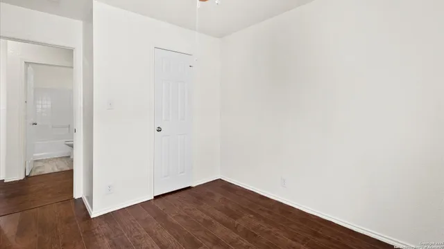 a bathroom with a glass shower door