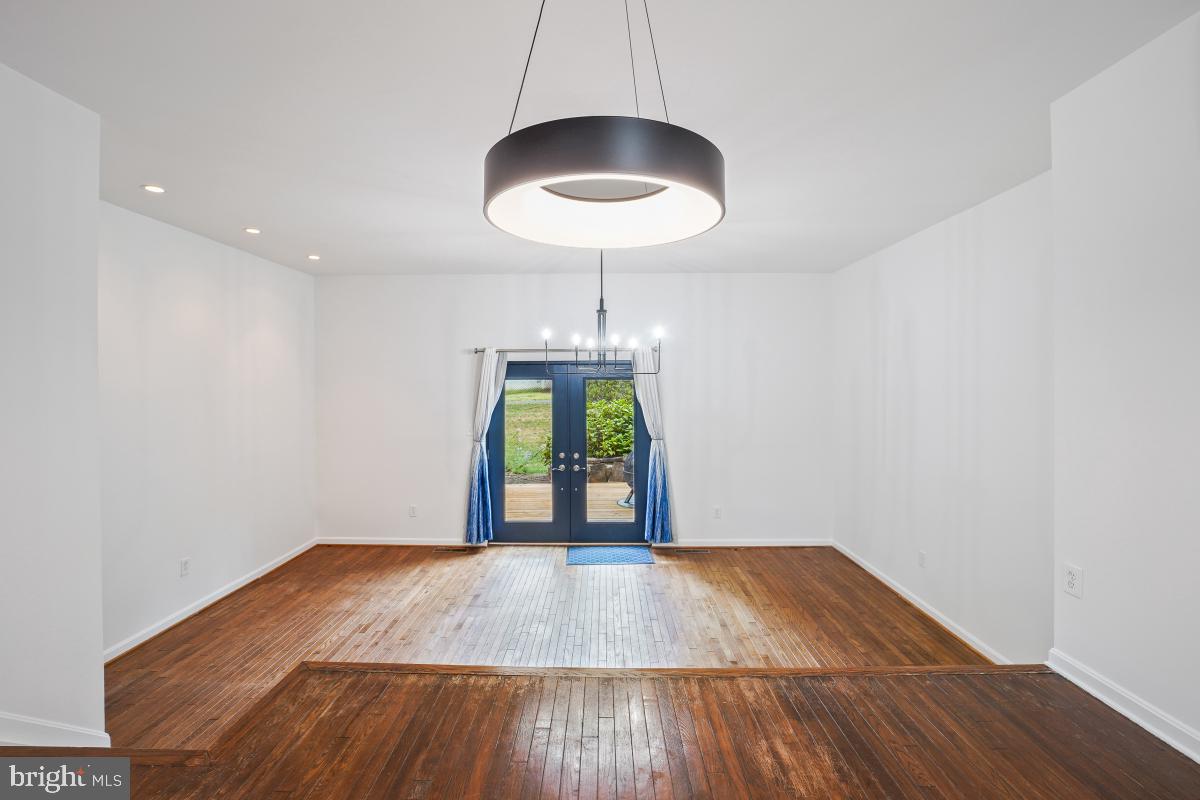 2134 Golf Course Drive Reston, VA 20191 - Photo 11 of 55 a view of an empty room with wooden floor and a window