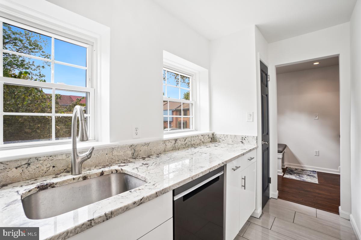 2134 Golf Course Drive Reston, VA 20191 - Photo 16 of 55 a kitchen with a sink and a window