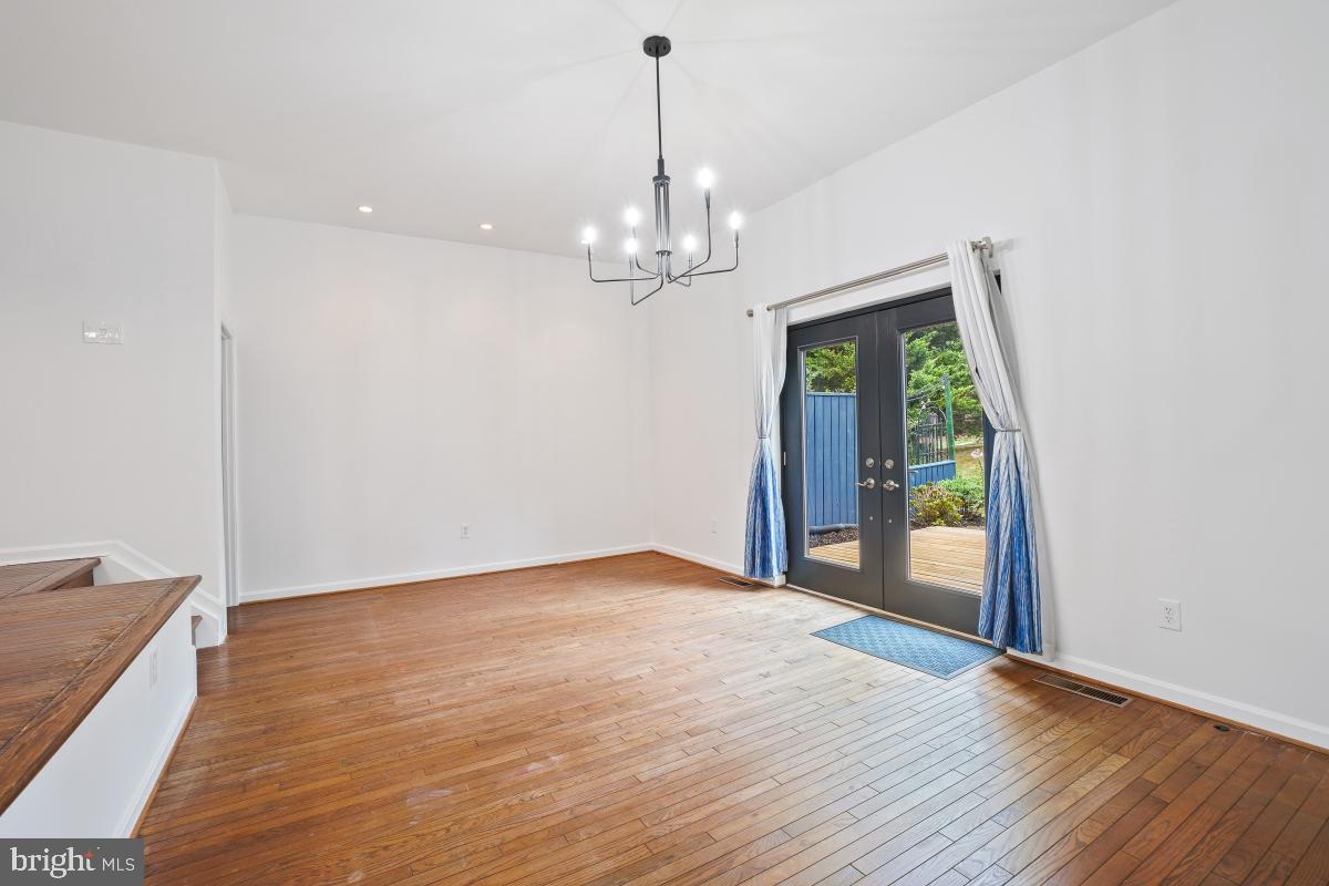 2134 Golf Course Drive Reston, VA 20191 - Photo 22 of 55 a view of an empty room with wooden floor and a window