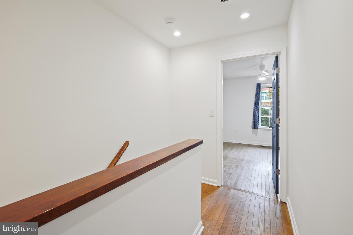 2134 Golf Course Drive Reston, VA 20191 - Photo 25 of 55 a view of hallway with wooden floor
