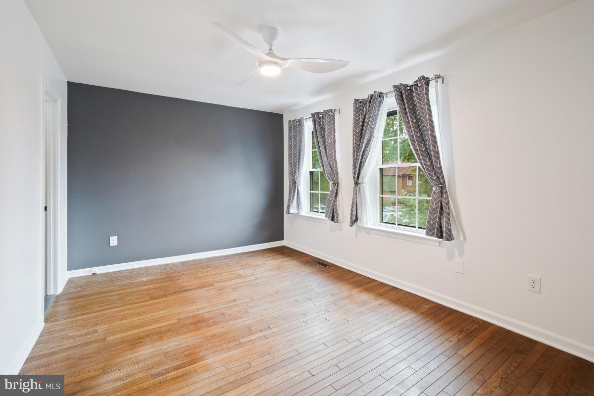 2134 Golf Course Drive Reston, VA 20191 - Photo 27 of 55 a view of an empty room with wooden floor and a window