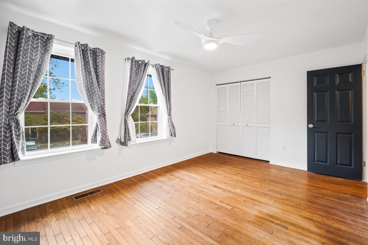 2134 Golf Course Drive Reston, VA 20191 - Photo 28 of 55 a view of an empty room with wooden floor and a window