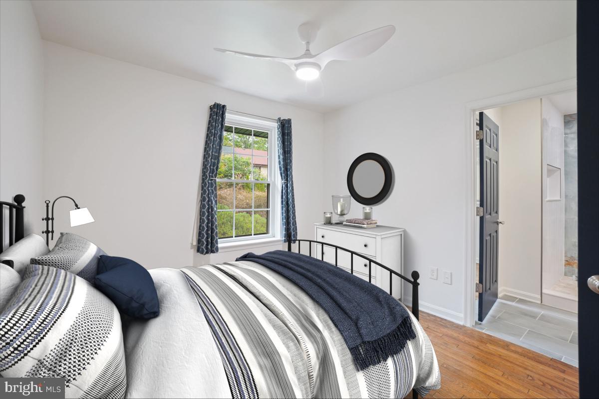 2134 Golf Course Drive Reston, VA 20191 - Photo 32 of 55 a bedroom with a bed and a window