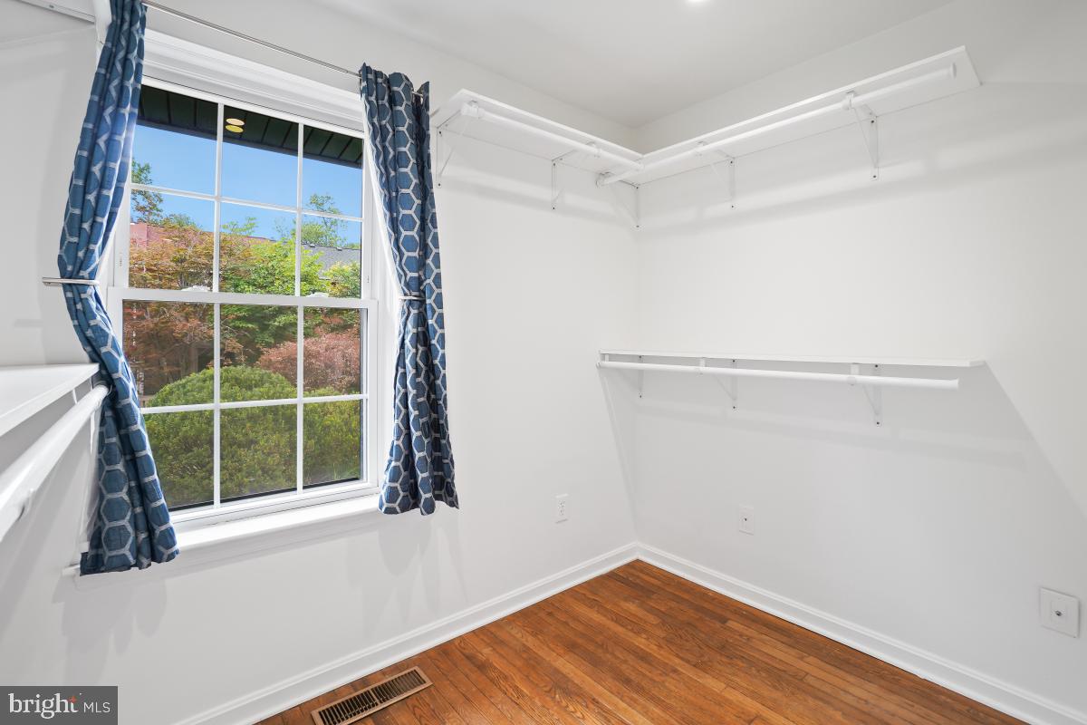2134 Golf Course Drive Reston, VA 20191 - Photo 40 of 55 a view of a room with wooden floor and windows
