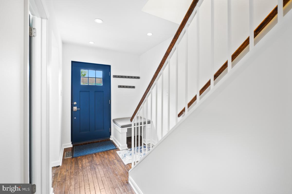 2134 Golf Course Drive Reston, VA 20191 - Photo 4 of 55 a view of staircase with wooden floor and stairs