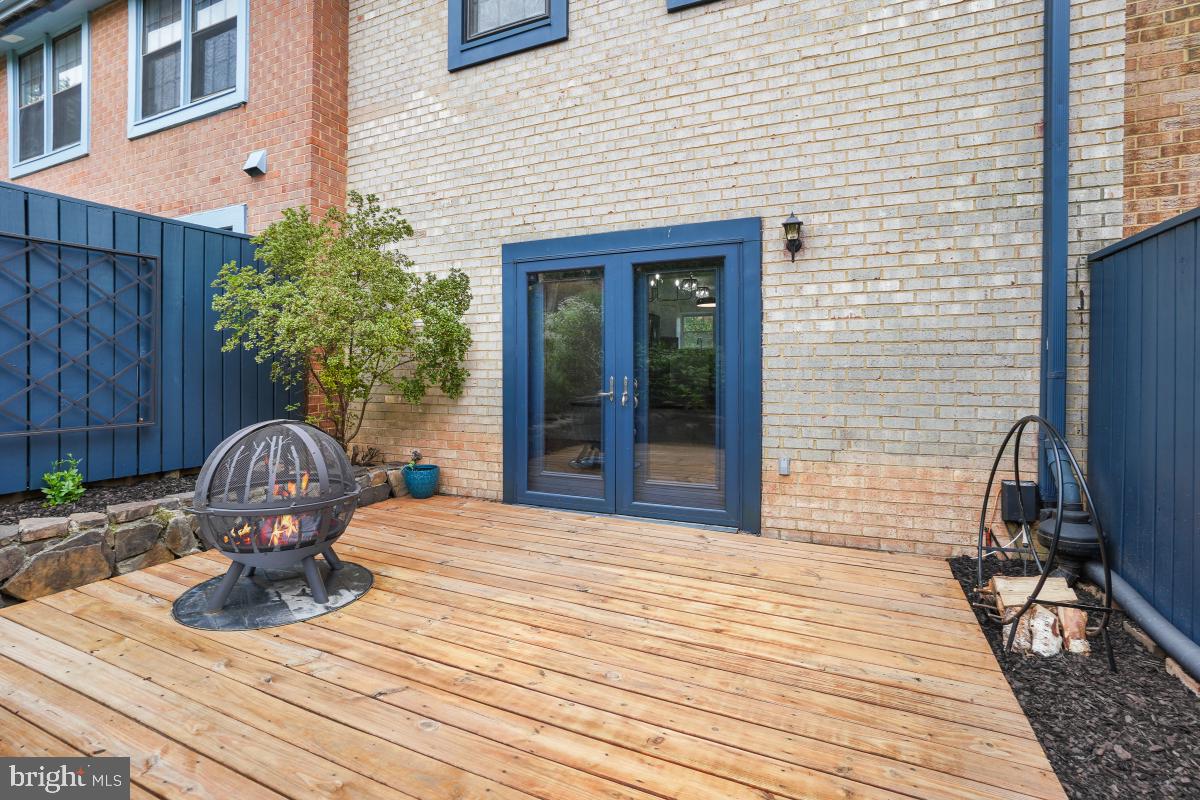 2134 Golf Course Drive Reston, VA 20191 - Photo 49 of 55 a table and chairs in front of a house
