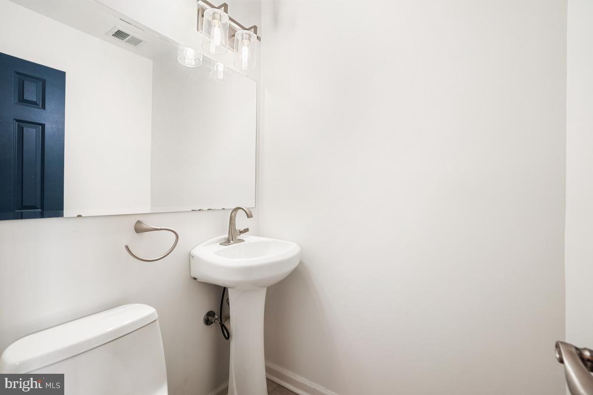 2134 Golf Course Drive Reston, VA 20191 - Photo 5 of 55 a bathroom with a sink a toilet and shower