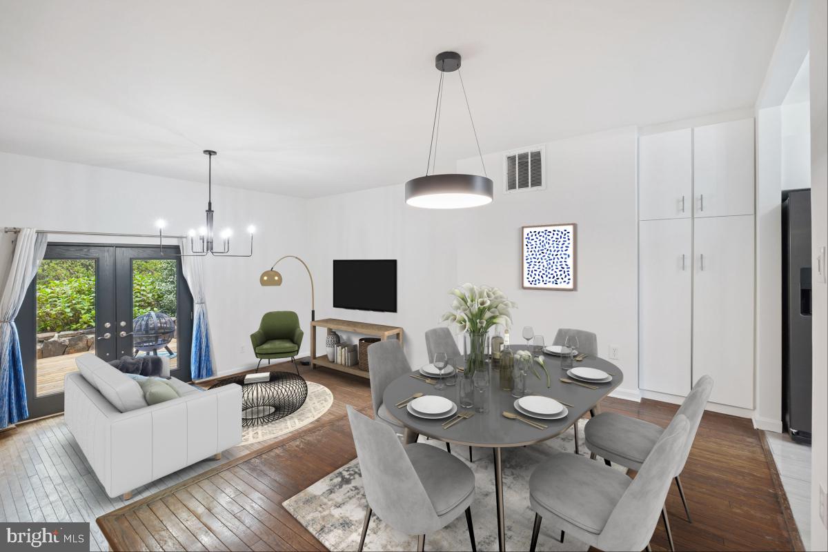 2134 Golf Course Drive Reston, VA 20191 - Photo 6 of 55 a living room with furniture a window and a chandelier