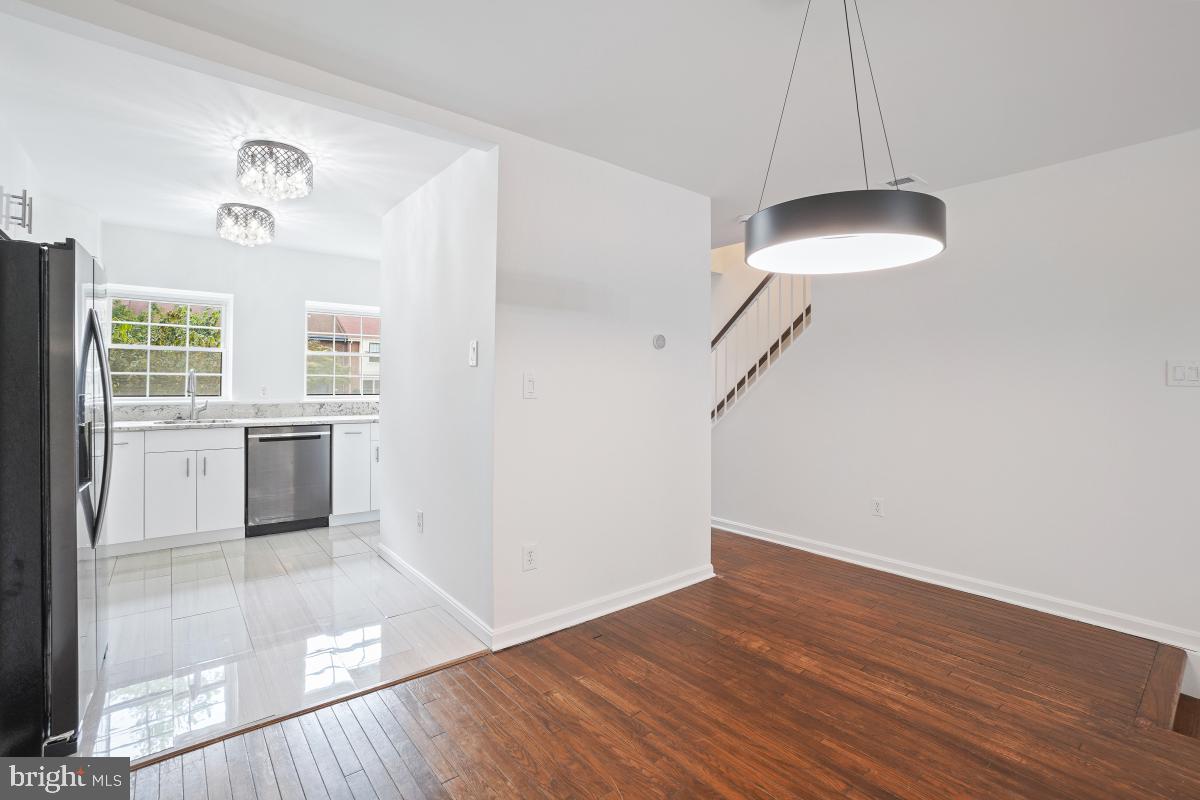 2134 Golf Course Drive Reston, VA 20191 - Photo 9 of 55 a view of empty room with wooden floor and fan