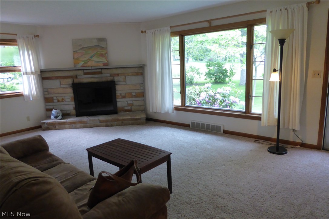 10316 Johnnycake Ridge Road Painesville, OH 44077 - Photo 2 of 30 View of Front Living Room .... One of Two Wood Burning Fireplaces in this Lovely Home, Brand NewCarpeting with Hardwood Underneath, Large Picture Window to Soak In the Gorgeous Landscaping!
