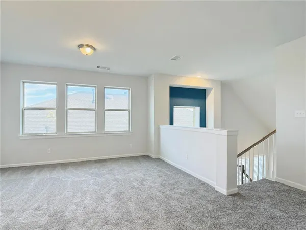 a kitchen with stainless steel appliances a stove and a microwave