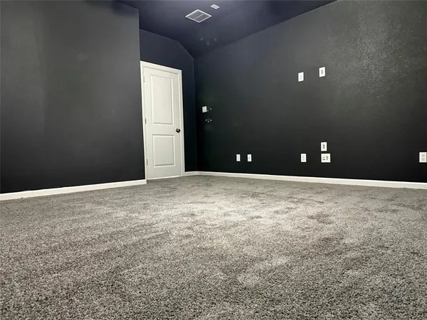 a view of staircase with white walls and windows