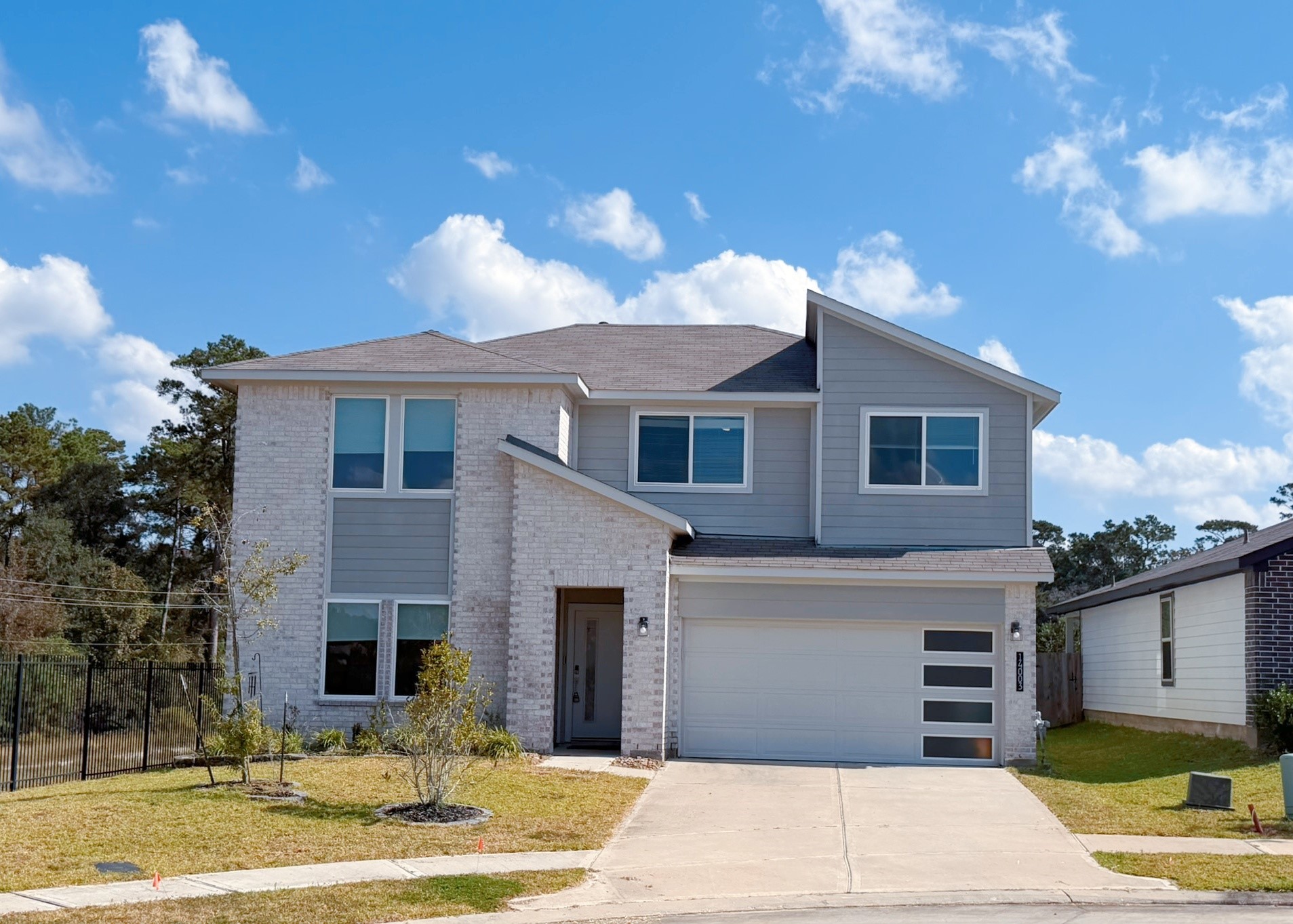 14003 Moose Creek Lane Conroe, TX 77384 - Photo 1 of 37 a front view of a house with a yard