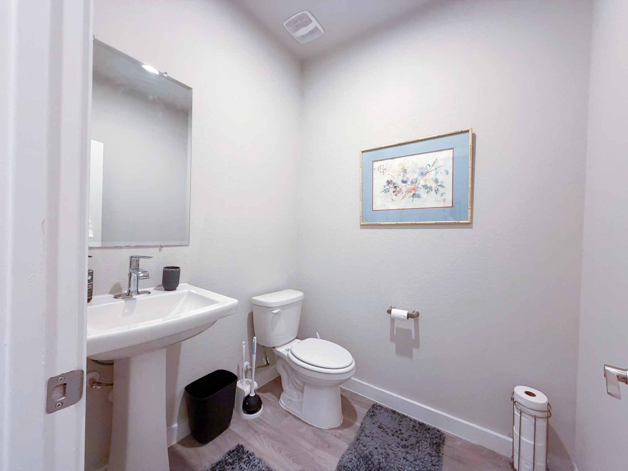 14003 Moose Creek Lane Conroe, TX 77384 - Photo 15 of 37 a bathroom with a toilet a sink and mirror