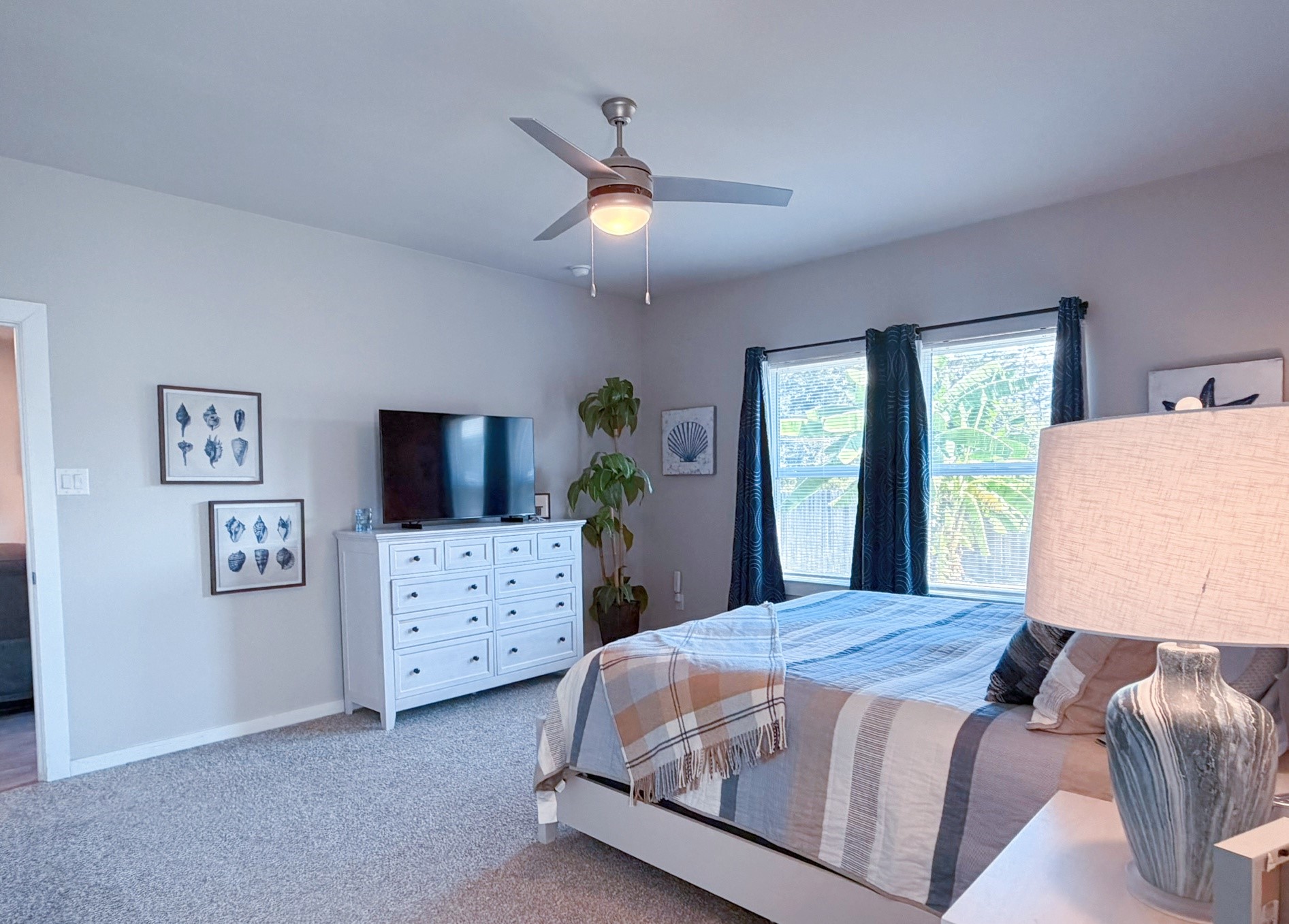 14003 Moose Creek Lane Conroe, TX 77384 - Photo 7 of 37 a bedroom with a large bed and a window