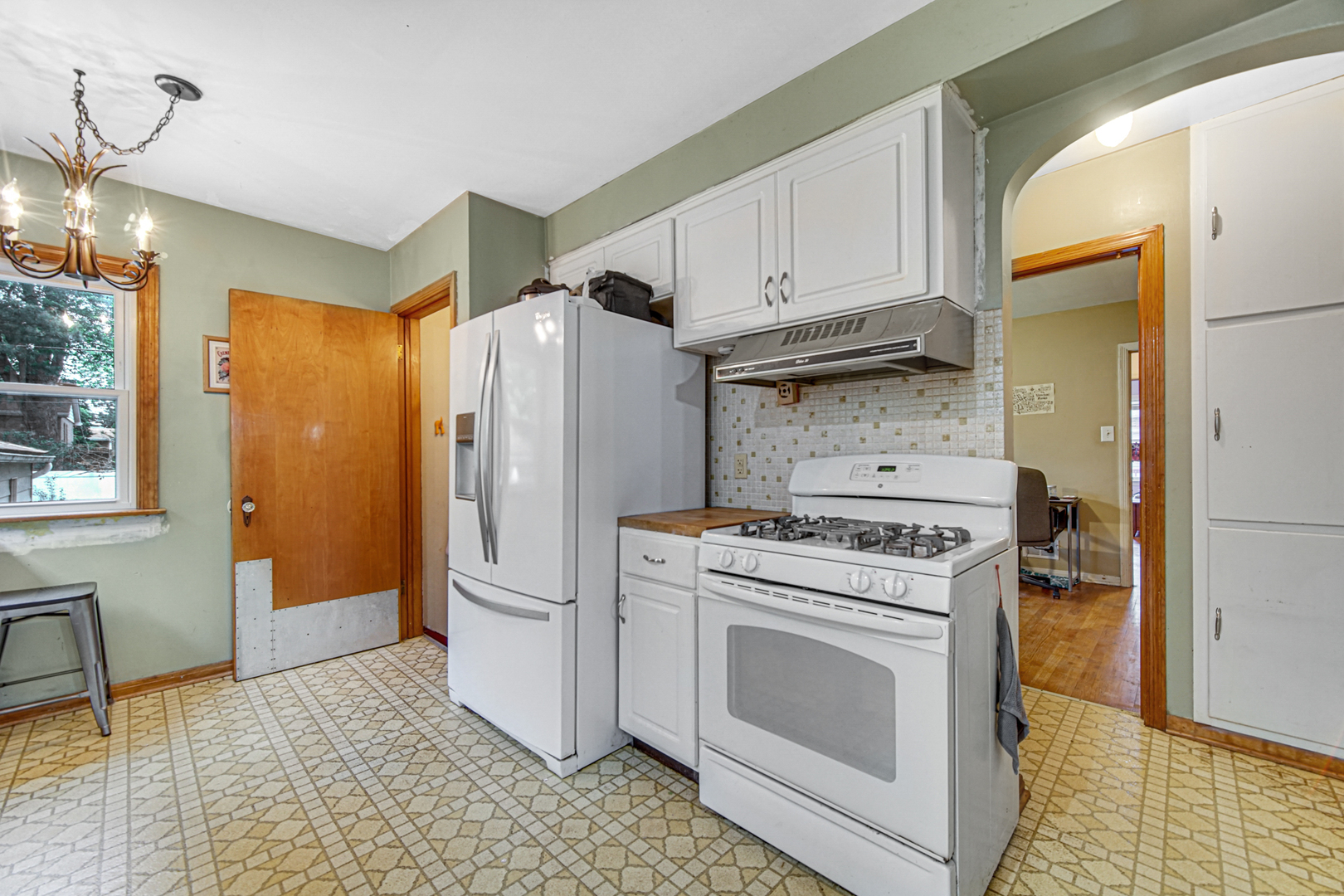 1644 West 187th Street Homewood, IL 60430 - Photo 12 of 24 a kitchen with stainless steel appliances granite countertop a refrigerator a stove and a sink