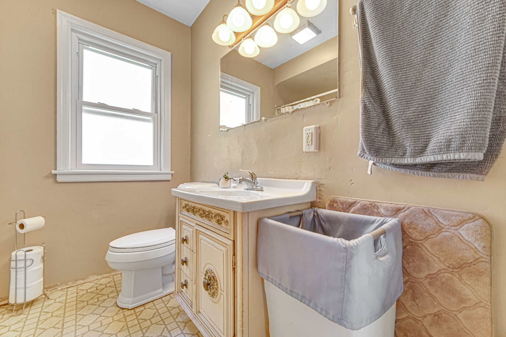 1644 West 187th Street Homewood, IL 60430 - Photo 16 of 24 a bathroom with a sink and a mirror