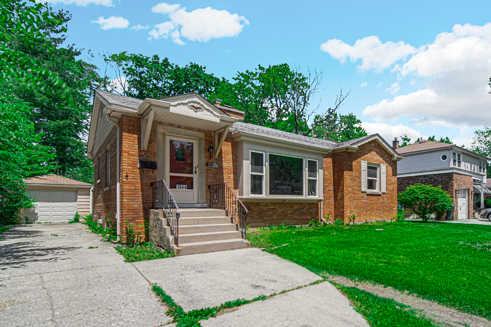 1644 West 187th Street Homewood, IL 60430 - Photo 3 of 24 a front view of a house with garden