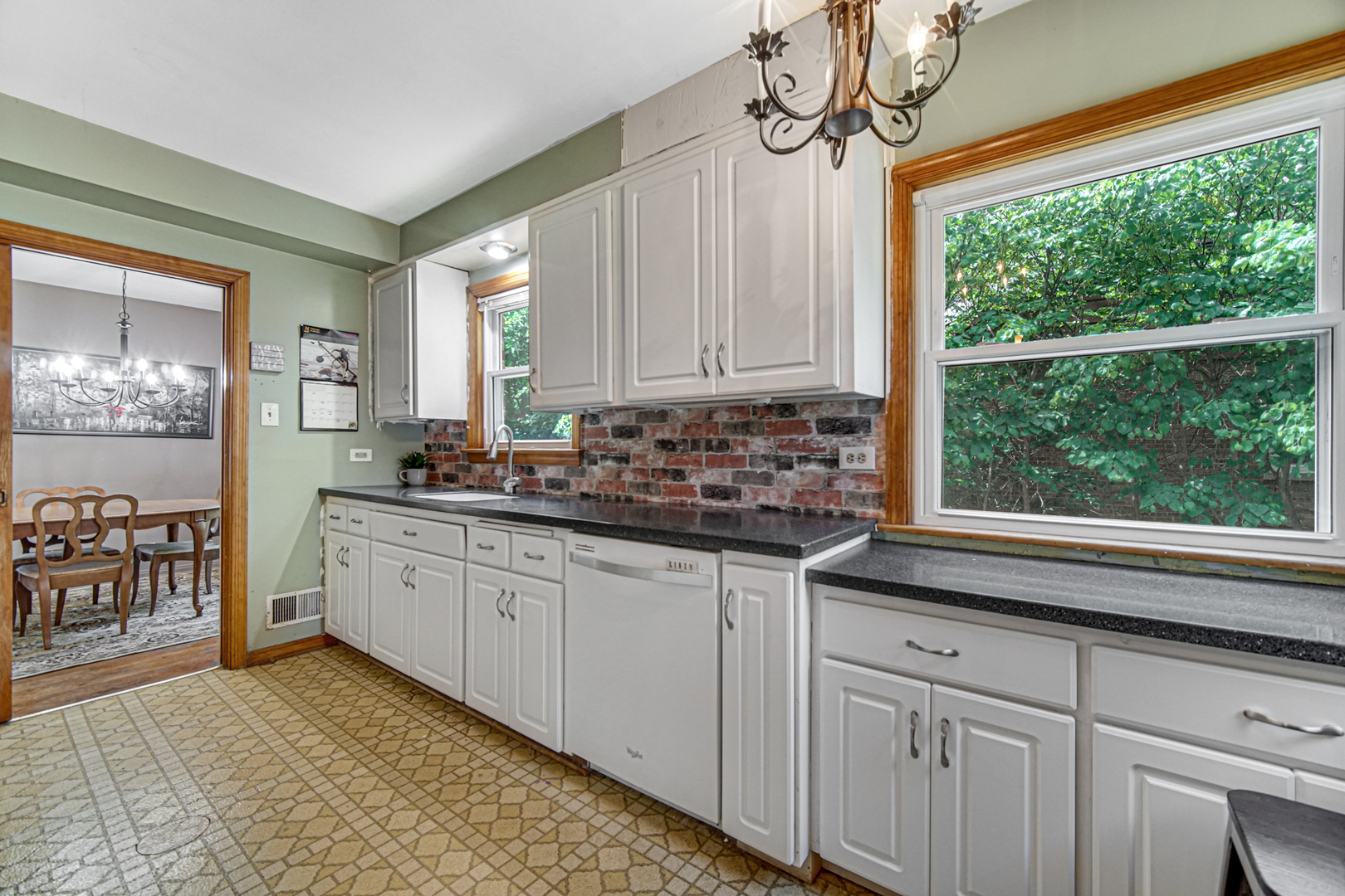 1644 West 187th Street Homewood, IL 60430 - Photo 10 of 24 a kitchen with granite countertop a sink window and cabinets
